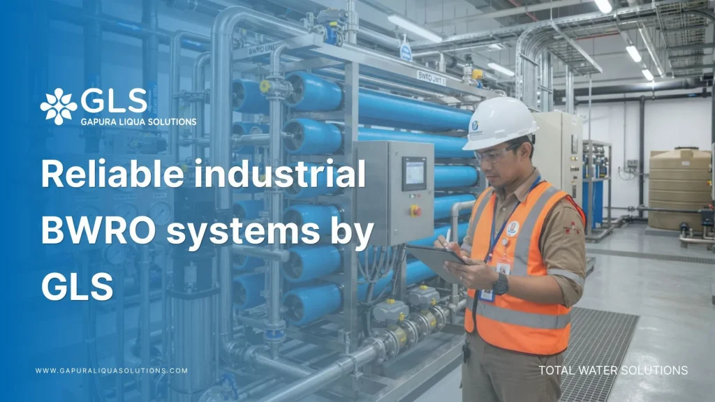 An Indonesian industrial engineer inspecting high-pressure reliable industrial BWRO systems in a modern manufacturing plant.