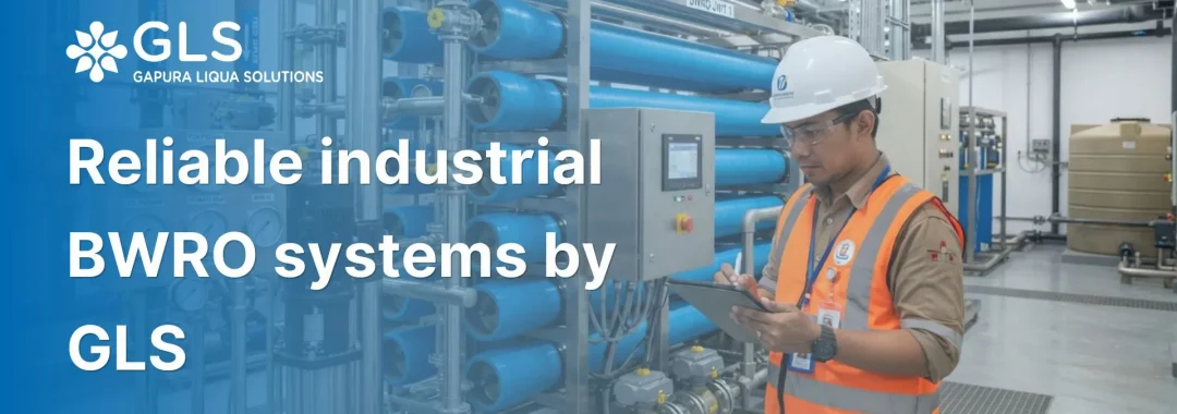 An Indonesian industrial engineer inspecting high-pressure reliable industrial BWRO systems in a modern manufacturing plant.